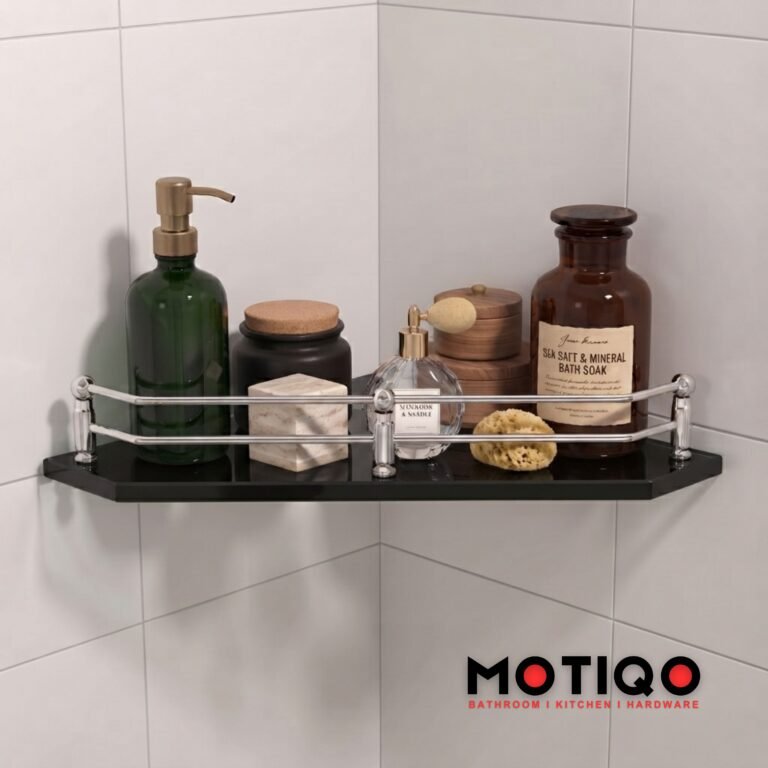 Black corner shower shelf with chrome guardrail holding various toiletries and bath products