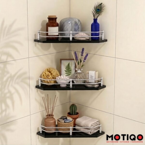 Three-tier black corner shelves with chrome guardrails mounted on a tiled bathroom wall